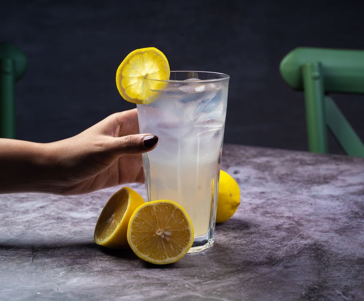 Fresh lemonade drink with ice and lemon slices
