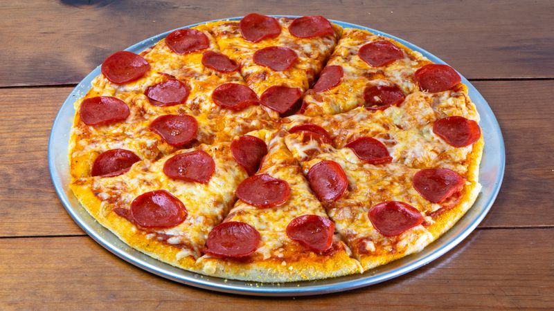 Meat Lovers deep dish pizza loaded with pepperoni and sausage